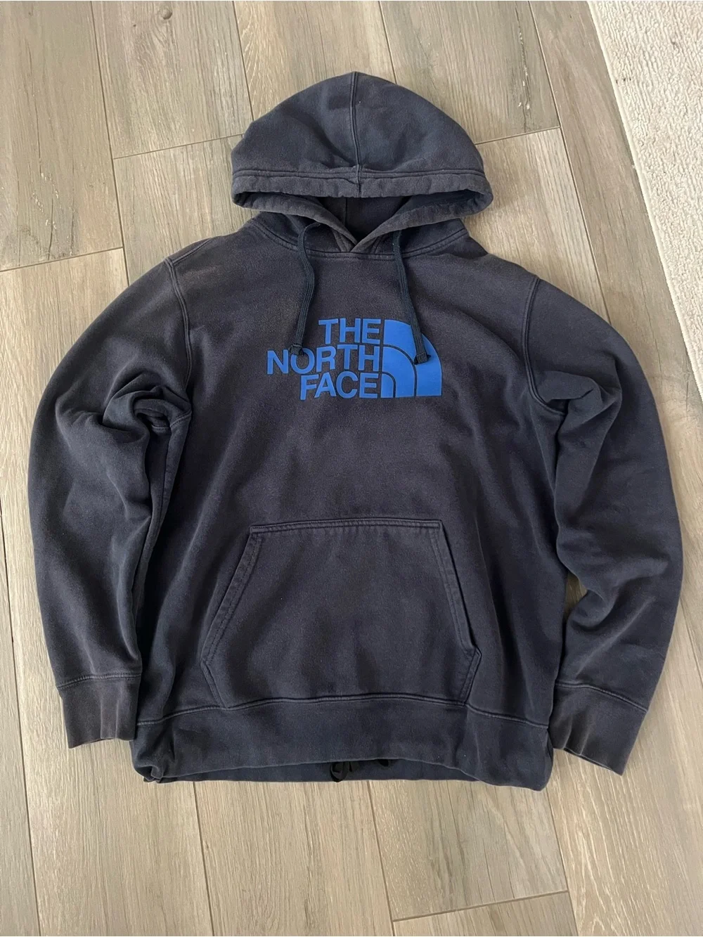 The North Face Black Pullover Hoodie with Blue Logo